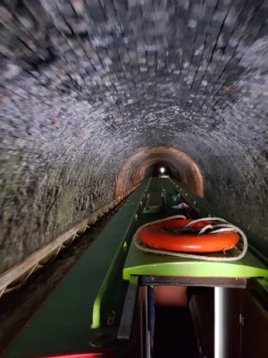 Navigating the Saddington Tunnel while canal boating in the UK.